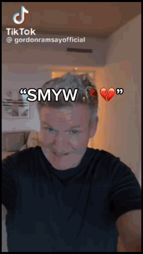 Gordon Ramsay Is Making A Funny Face With A Broken Heart In The Background GIF