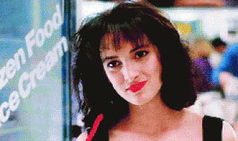 Gorgeous Winona Ryder Eating Smirk GIF