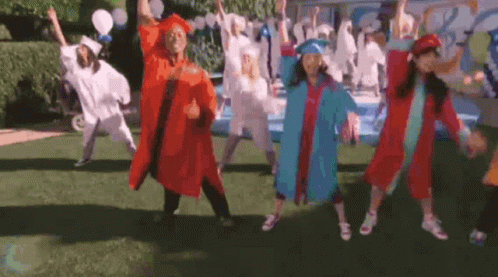 Graduates Dancing in Field