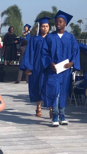 Graduation Man And Woman In Blue Gowns GIF