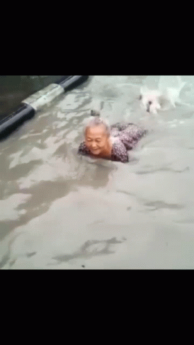 Granny Enjoying Flooded Water GIF