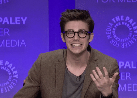 Grant Gustin Awkward Shrug GIF
