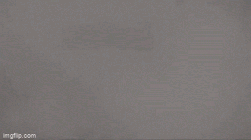 Gray Background With Triangles And Light GIF