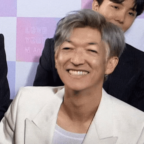 Gray Hair Man In White Jacket Smiling At Love Yourself Sign GIF