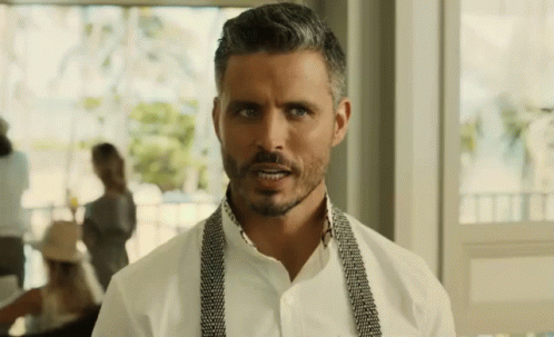 Gray-Haired Bearded Man in White Shirt and Suspenders