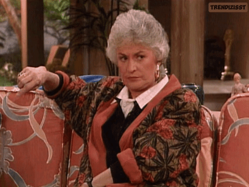 Gray-Haired Woman Pointing At Camera GIF
