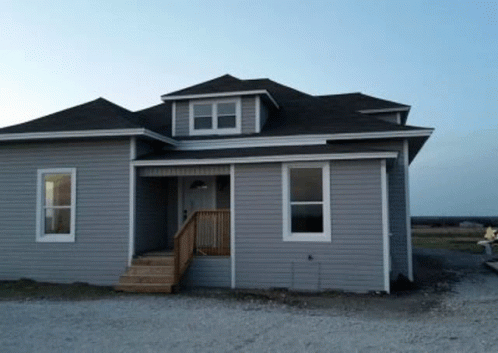 Gray House With Black Roof And Stairs GIF