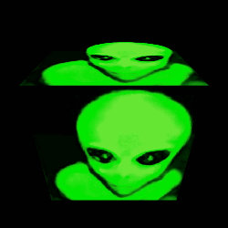 Green Alien with Black Eyes Looking at Camera