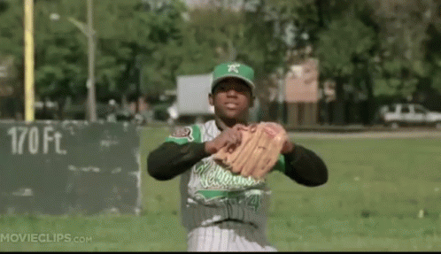 Green and White Baseball Player with X on Cap