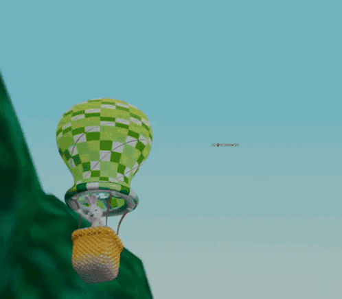 Green And White Hot Air Balloon Over Hill GIF