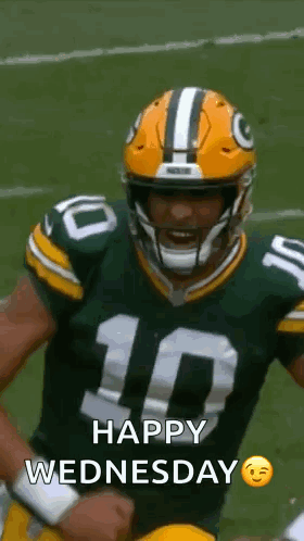 Green Bay Packers Player Holding Fist In Air With Helmet GIF