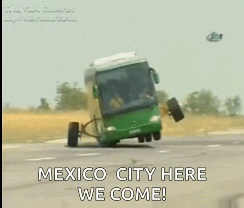 Green Bus Driving Down Road Saying Mexico City Here We Come