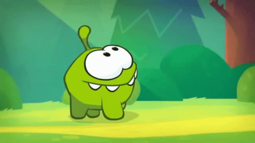 Green Cartoon Character Standing in Grass