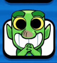 Green Cartoon Character With Big Eyes and Big Smile Sitting