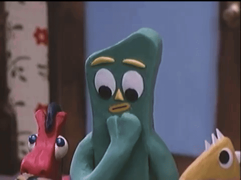 Green Cartoon Character With Big Eyes And Yellow Beak
