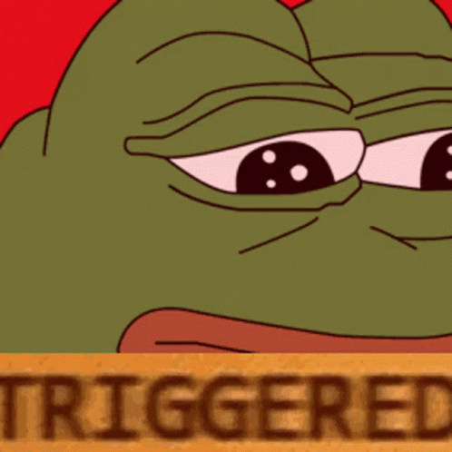 Green Frog Behind Brown Sign Saying Triggered