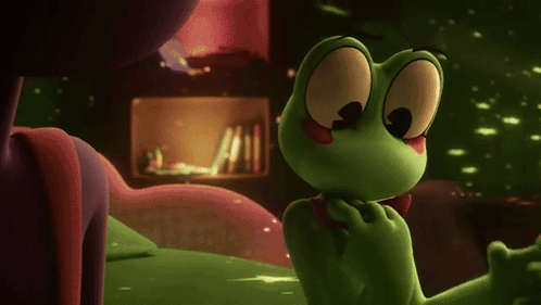 Green Frog in Red Bow Tie Beside Purple Frog