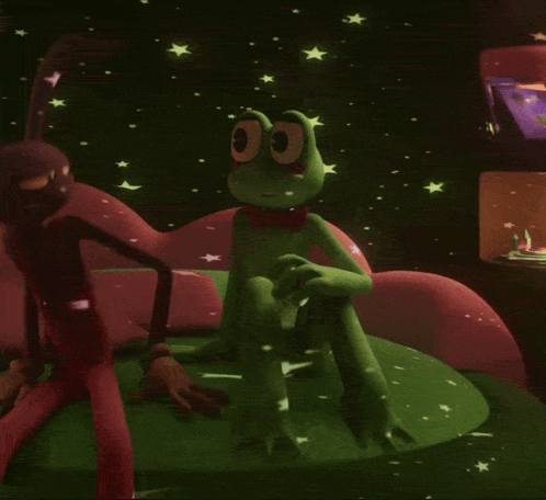 Green Frog in Red Bow Tie Sitting on Couch