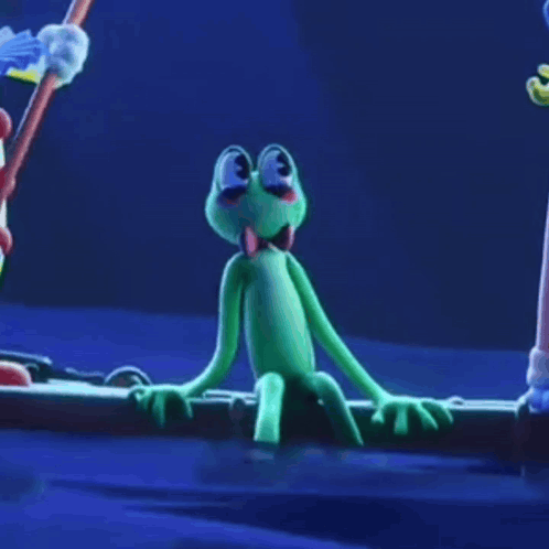 Green Frog With Bow Tie Sitting on Log