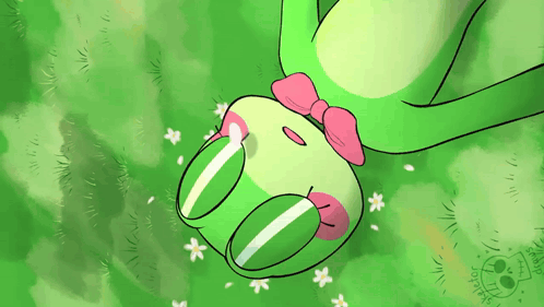 Green Frog With Pink Bow Laying in Grass