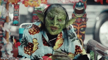 Green Goblin in Pineapple Shirt at Microphone