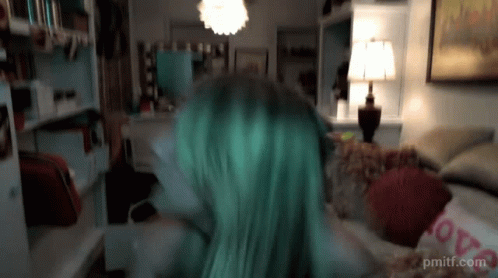 Green Hair Woman on Couch With Love Pillow