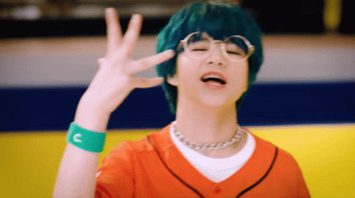 Green-Haired Boy, Glasses, Orange Shirt, Green C Wristband GIF