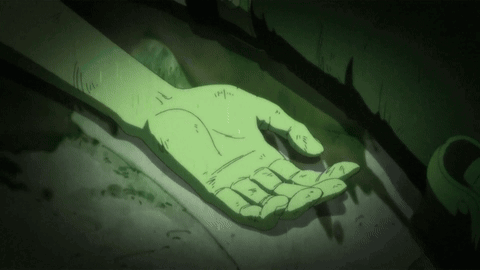 Green Hand Laying on Paper With Lines