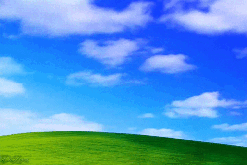 Green Hill With Blue Sky And White Clouds GIF