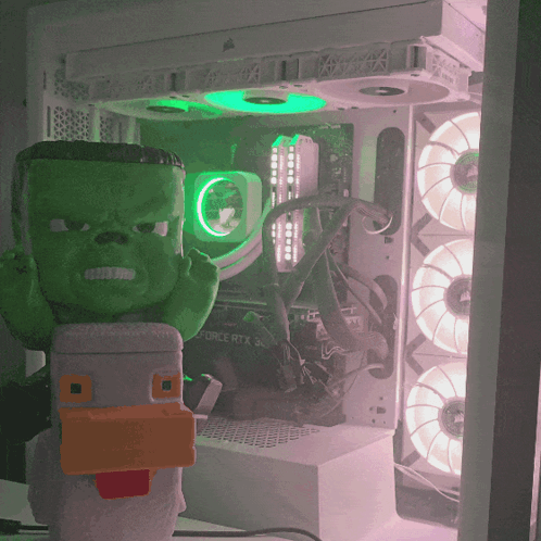 Green Hulk Figurine In Front Of Corsair RTX 30 Motherboard GIF