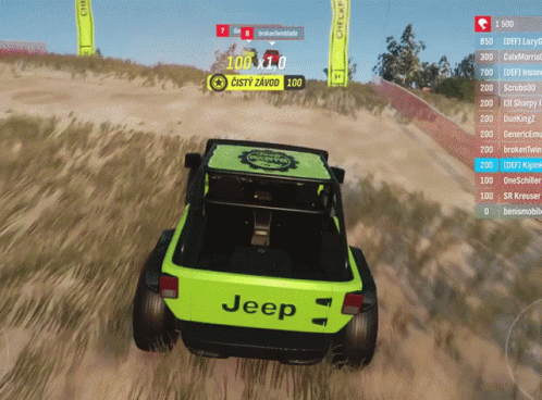 Green Jeep Driving Through Grass