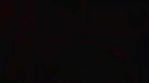 Green Light Shining Through Dark Room GIF