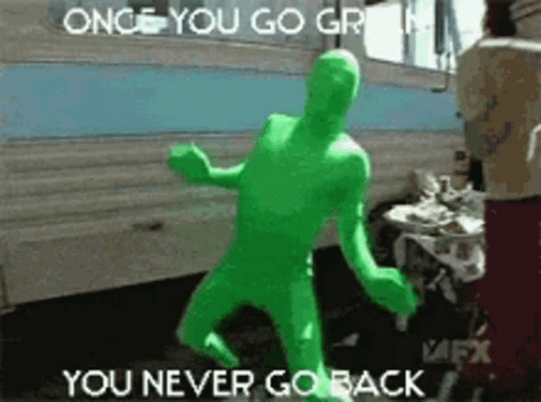 Green Man in Green Suit Dancing by Trailer Says Once You Go Green You Never Go Back