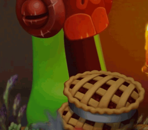 Green Monster Holding Pie Next to Candle