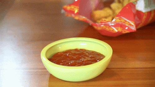 Green Salsa Bowl Next to Chips