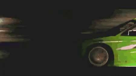 Green Sports Car Driving at Night