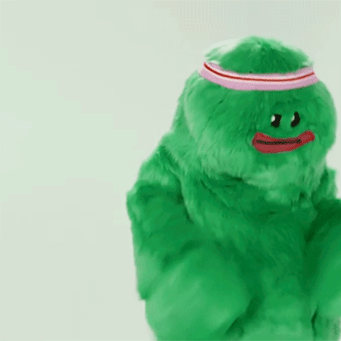 Green Stuffed Animal With Red Heart