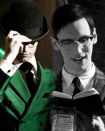 Green Suit Man Reading Book Beside Black And White Photo GIF