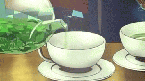 Green Tea Poured into White Cup on Saucer
