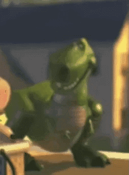 Green Toy Dinosaur Wearing Headphones GIF