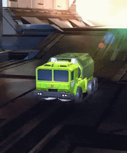 Green Truck With Transformer Logo Driving
