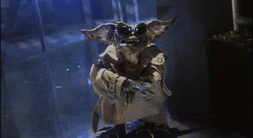 Gremlin in Trench Coat in Dark Hallway
