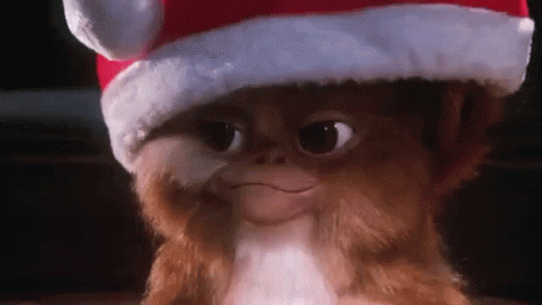 Gremlin Wearing Santa Hat Smiling