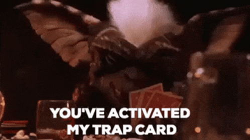 Gremlin with Cards Saying You've Activated My Trap Card