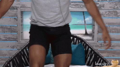 Grey Shirt Black Shorts Man Sitting On Love Island Couch GIF
