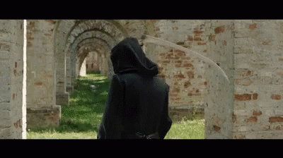 Grim Reaper Holding Scythe Turning Around GIF