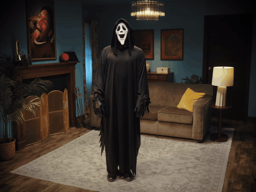 Grim Reaper Costume Standing In Living Room GIF