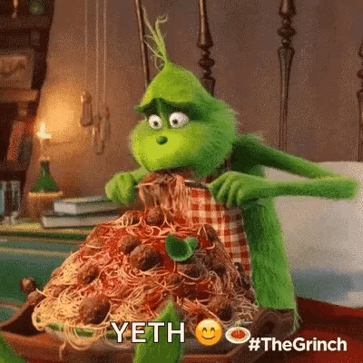 Grinch Eating Spaghetti and Meatballs With Knife and Fork