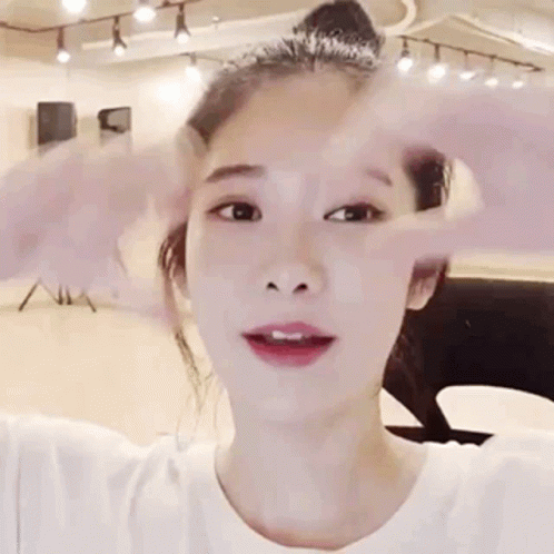Grinning Girl Hand Heart Sign GIF