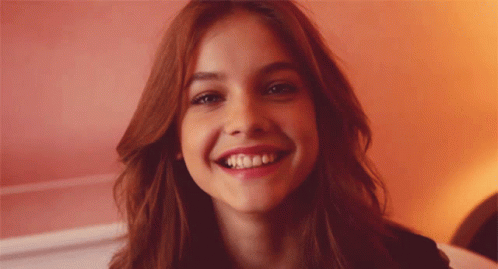 Grinning Girl Looking Shy GIF